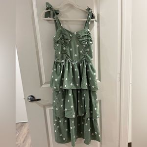 Green and white polka dot dress with tie straps.